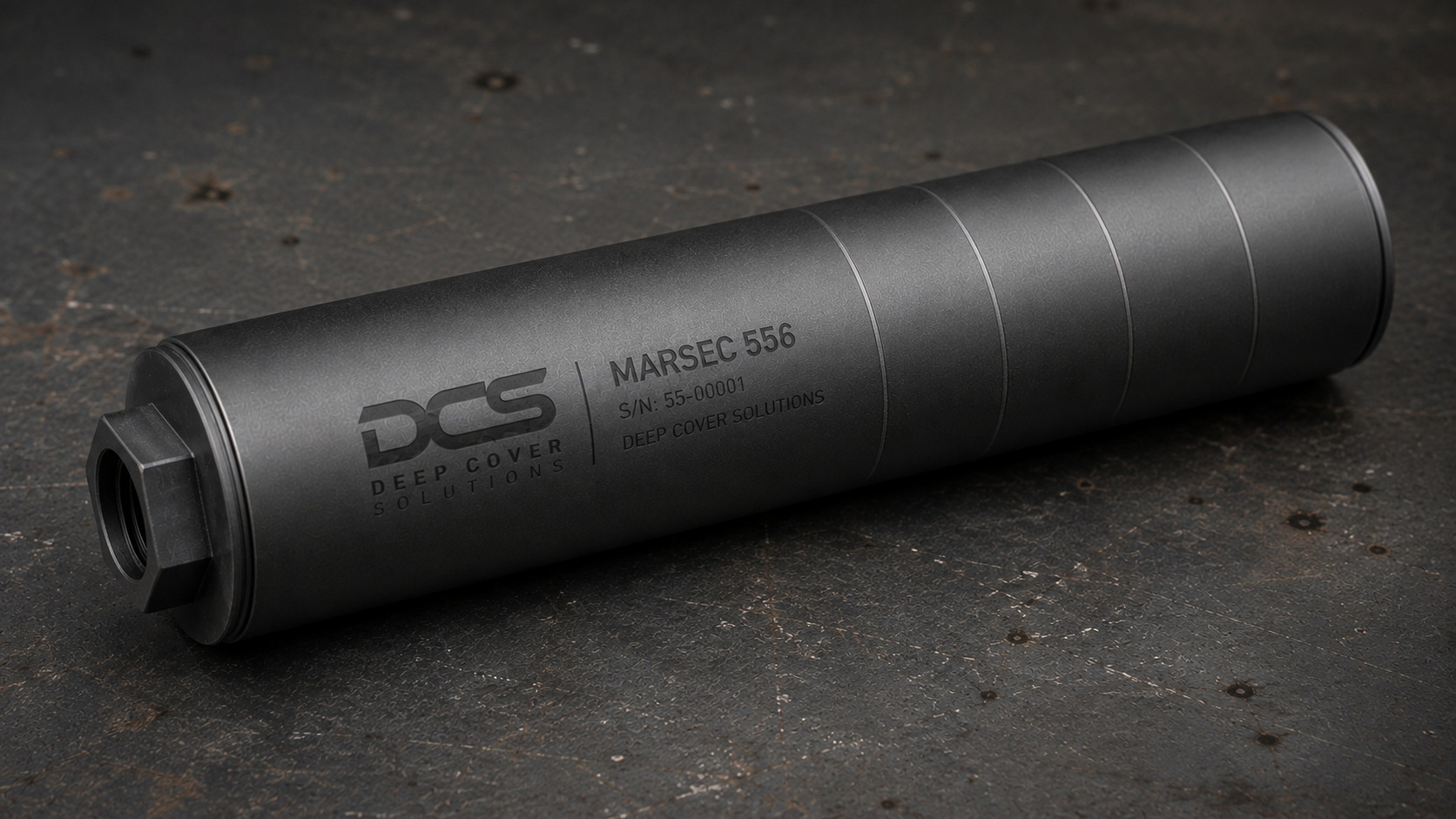 Black MARSEC 556 suppressor with engraved DCS markings